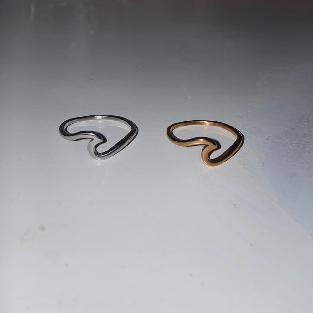 Silver and rose gold wave rings. Size 10